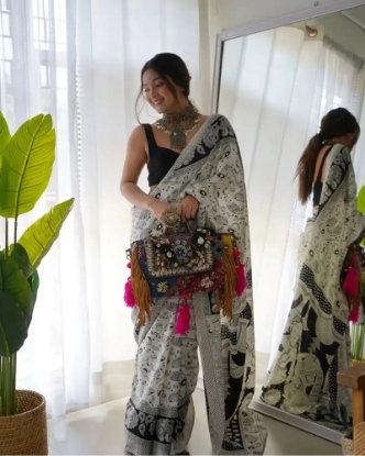 Picture of Mesmerizing Georgette Saree with Black & White Musical Notes