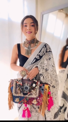 Picture of Mesmerizing Georgette Saree with Black & White Musical Notes